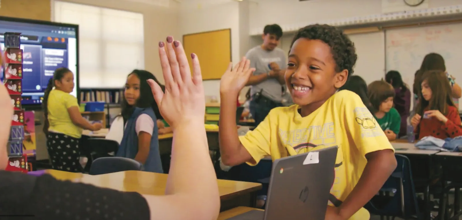 Students high-fiving during QUEST